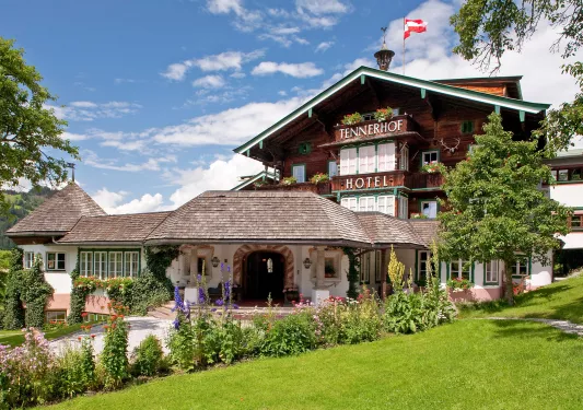 Wooden building with a grass field in front