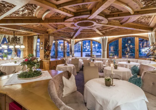 Indoor dining area with carved wood on the ceilings
