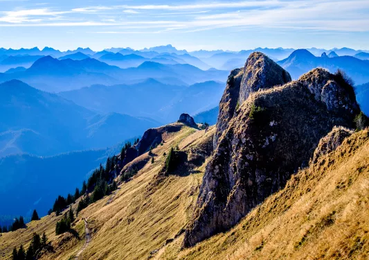 Rocky hill with large mountains in the distance