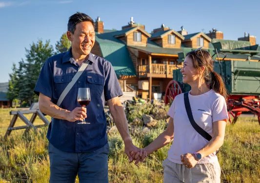 Man and woman holding hands , smiling at each other