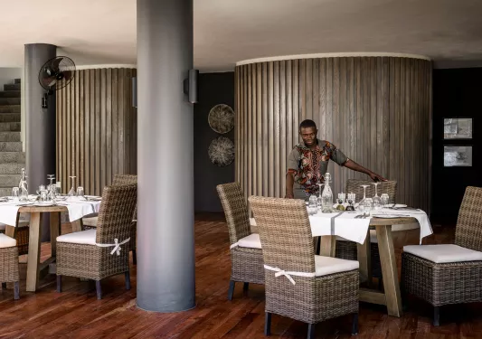 a man sets dining room table