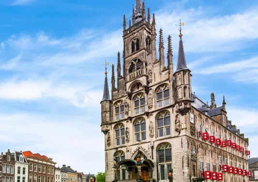 Tall, stone castle in a town center