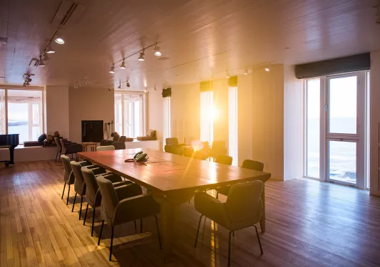 large dining room table in sunlit room