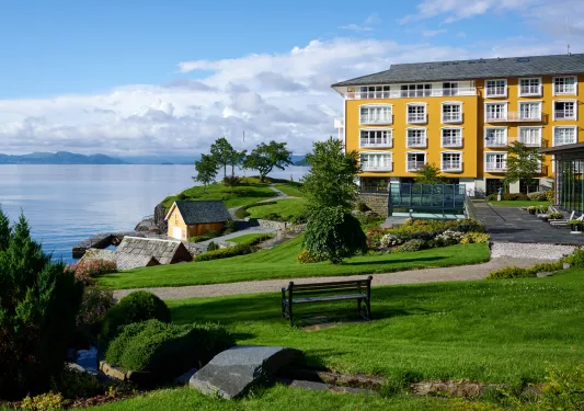 yellow house on a cliff