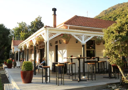 White building with outdoor seating area