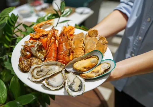 An assortment plate of mussels, oysters, lobsters and other seafood