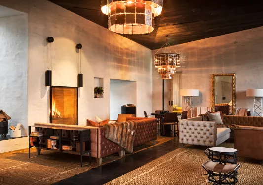 living room with big chandelier and fire place