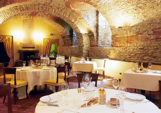 dining room with arched stone cielings