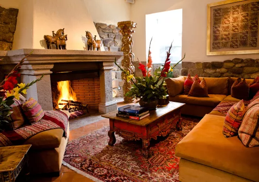 couch and coffee table around a fireplace