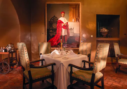 dining room table in front of portrait