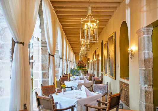 row of tables in a narrow room 