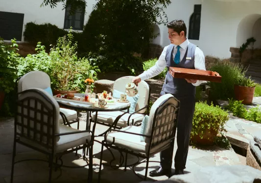 waiter setting table outside