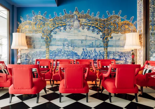 red chairs in a room with blue tile backsplash