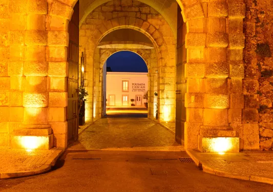 Stone archways leading to hotel entrance