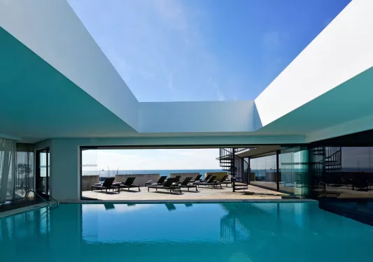 hotel pool with lounge chairs