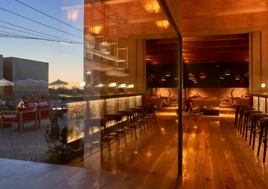 Reflection of a wine cellar and a bar and lounge to the left