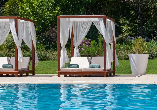 covered lounge chairs by the pool