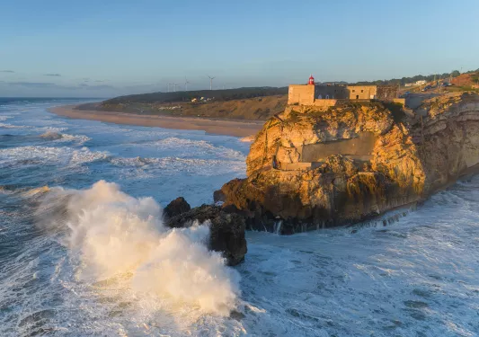 crashing waves on a jetty