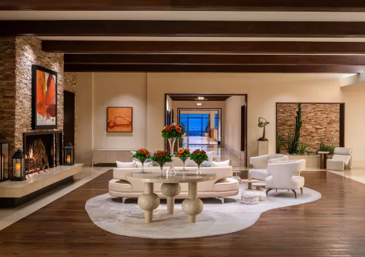 Indoor lobby with a white couch over a white rug
