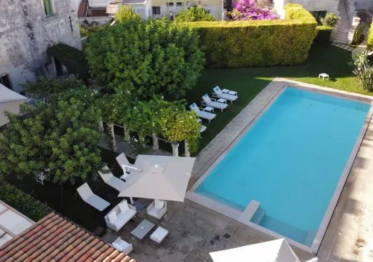 hotel swimming pool surrounded by lounge chairs