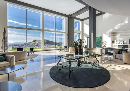 Glass table in the middle of an open lobby