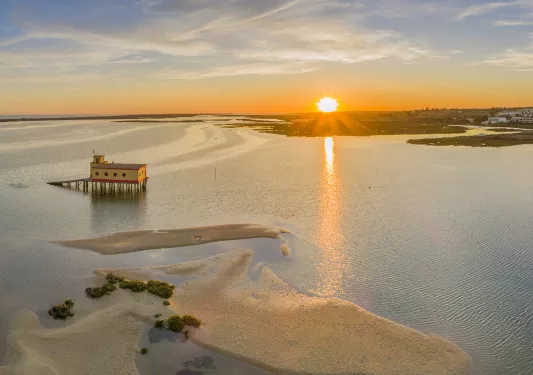 Beach with a sunset in the distance