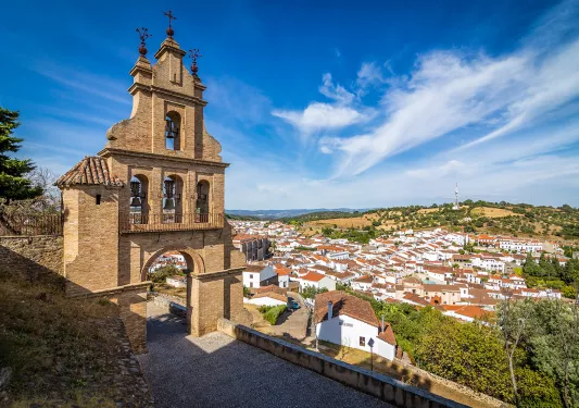 Rustic bell tower overlooking a small town