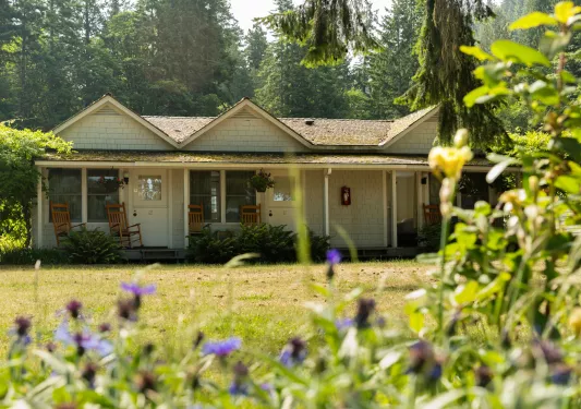Hotel rooms with rocking chairs on the porches