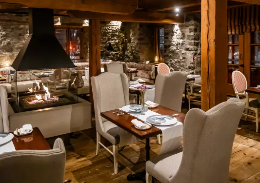 dining room with fireplace in the middle