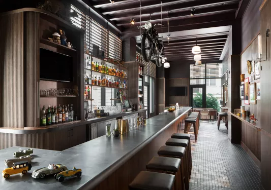 bar with motorcycle suspended above it