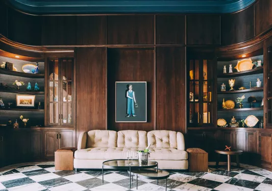 mahogany room with a couch and portrait