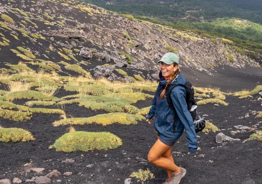 Woman hiking up hill