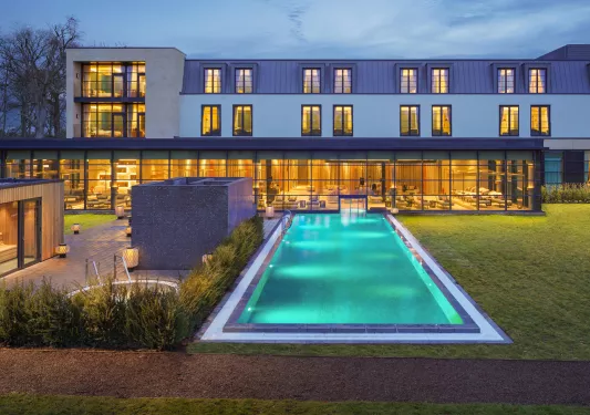 Large swimming pool outside of hotel