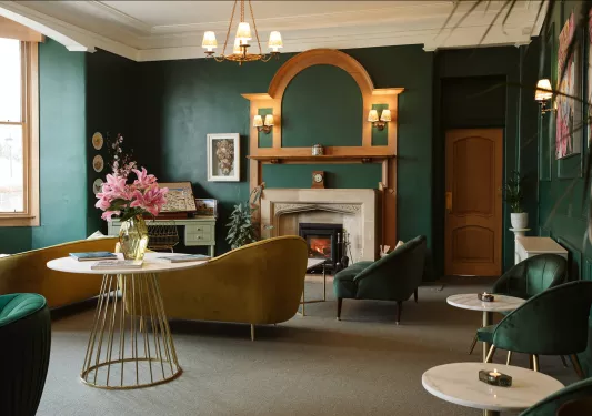 Lobby with yellow and dark green couches