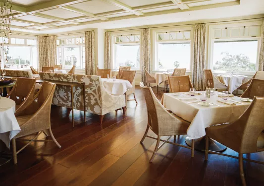 Dining hall with dining tables and brown chairs