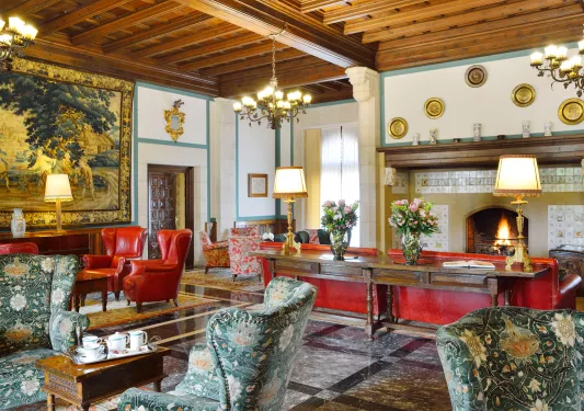 Lobby with red and white chairs and furniture and metal fixtures on the walls