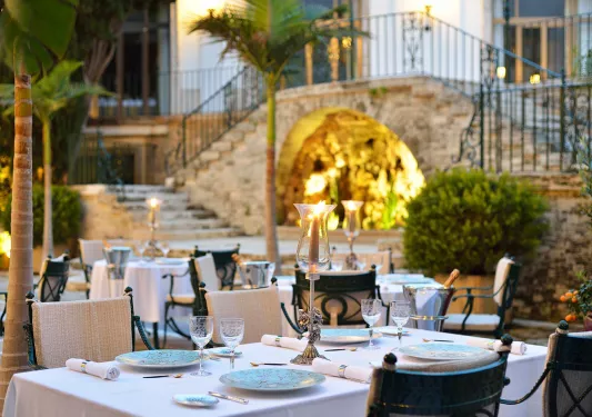 Outdoor dining area with a staircase in the background