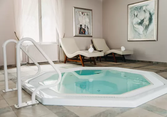 Hot tub next to lounge chairs