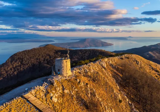 stone watchtower on a mountain peak