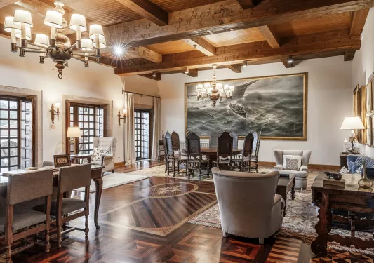 grand hotel lobby with tables and armchairs