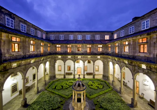 Outdoor courtyard with an antique stature in the center