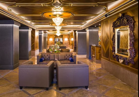 ornate hotel lobby and chandeliers