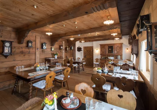 Indoor cabin dining hall, with antique clocks on the wall
