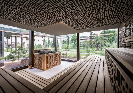 Outdoor sauna with windows looking out to a courtyard