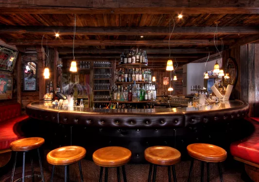 round hotel bar with barstools