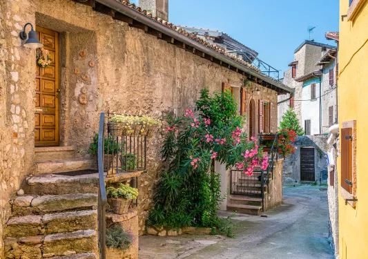 Alleyway leading to entrances to rustic houses