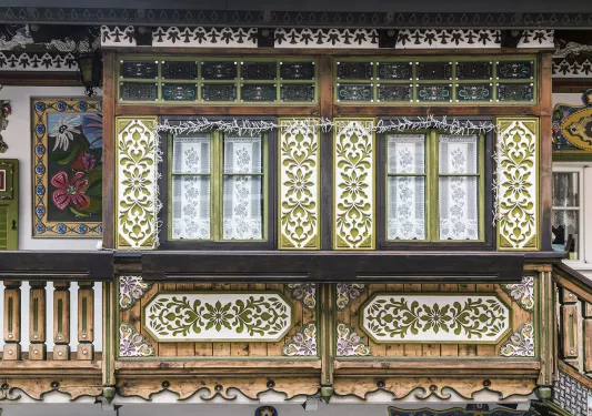 Rustic, artistic balcony with green and white flowers