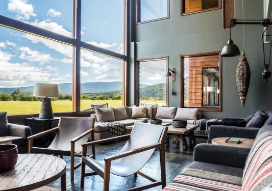 Lounge with cushioned couches and coffee tables