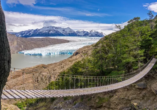Wooden bridge connecting two dirt cliffs