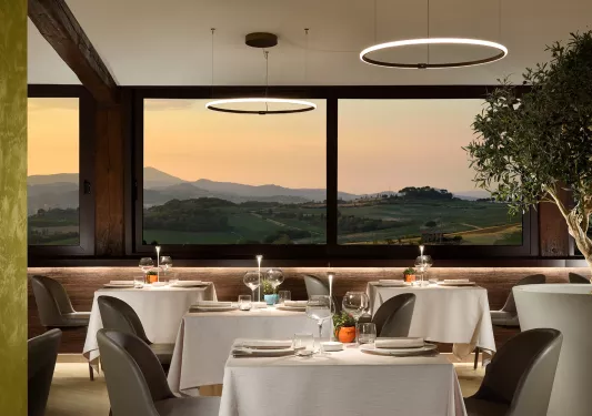 hotel dining room with view of the mountains at sunset